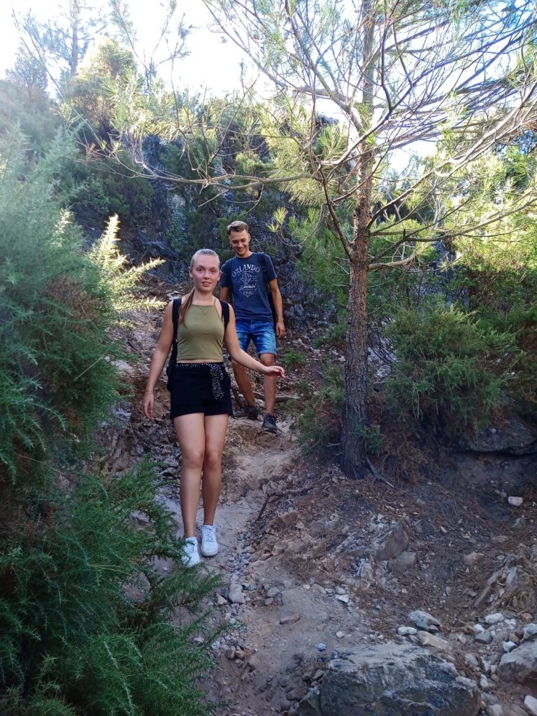Couple hiking to Juanar Peak Marbella